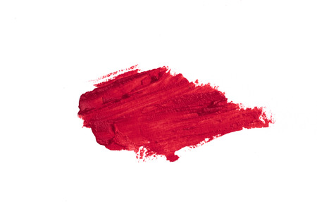 Smudged red lipstick isolated on white backgroundの写真素材