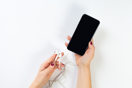 hand holding phone, clipping path inside.の写真素材