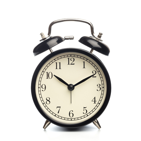 Black retro alarm clock on isolated background
