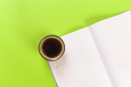 magazine mock up with coffee on green backgroundの写真素材