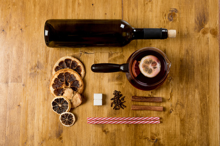 Mulled wine with ingredients on wooden background, top viewの写真素材