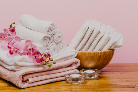 Spa still life with aromatic candles,orchid flower and towel. - Imageの写真素材