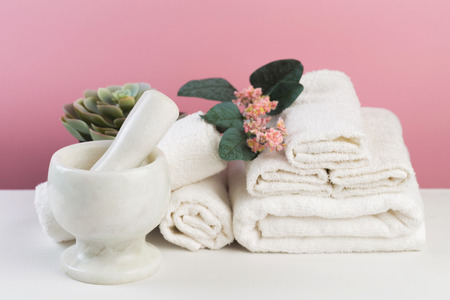 Spa still life with aromatic candles, flower and towel. - Image