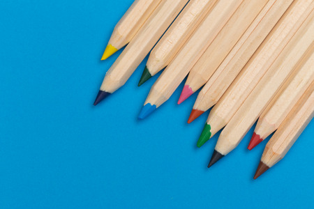 colour pencils on blue backgroundの写真素材