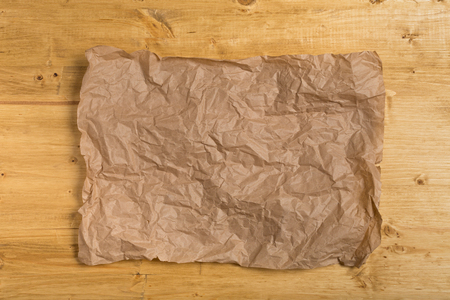 old texture paper on wooden backgroundの写真素材