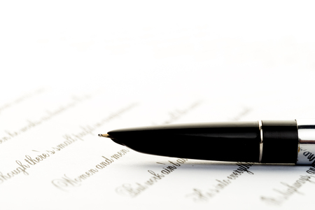 vintage fountain pen on letterの写真素材