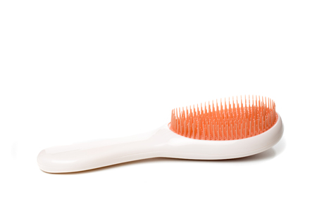 plastic hair brush for wet hair, isolated on white backgroundの写真素材