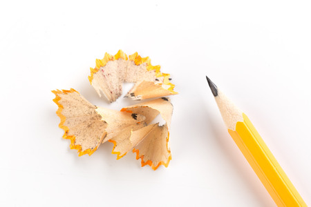 Wooden pencil isolated on a white background with shavingsの写真素材