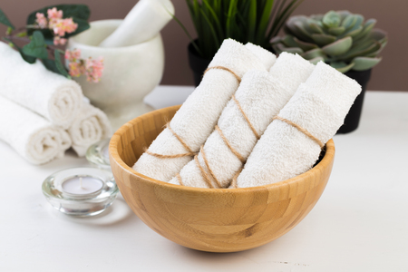 Spa still life with aromatic candles, flower and towel. - Imageの写真素材