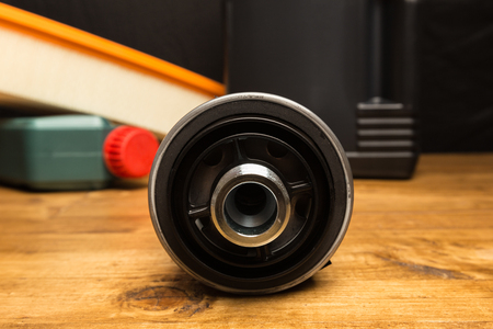 oil car filter on wooden backgroundの写真素材