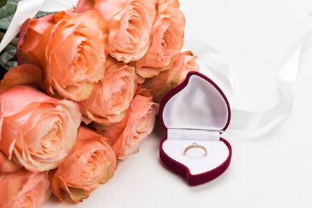 pink roses and box holding wedding ring -  Image