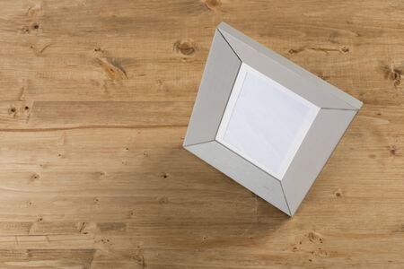 gray frame on wooden background