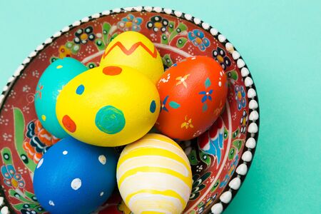 easter eggs on green background, top view