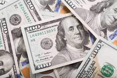 Close up heap of one hundred dollars, selective focus. Dollars, the us money backgroundの写真素材