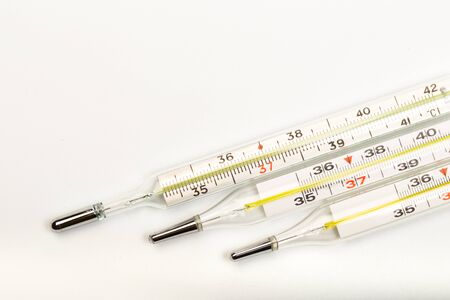 mercury thermometers on white background close up view- Imageの写真素材