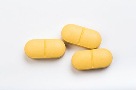 set of yellow tablets  on a white background - Imageの写真素材