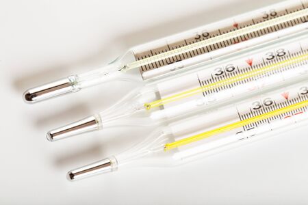 mercury thermometers on white background close up view- Image