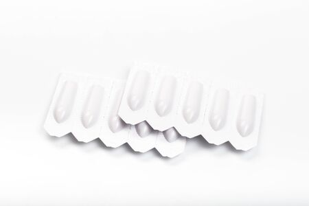 plastic packs of suppositories on white  background - Image