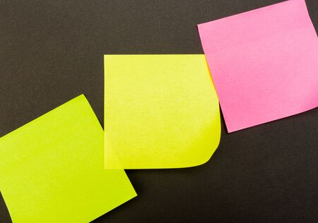 set of colour  paper stick note on a black background - Image
