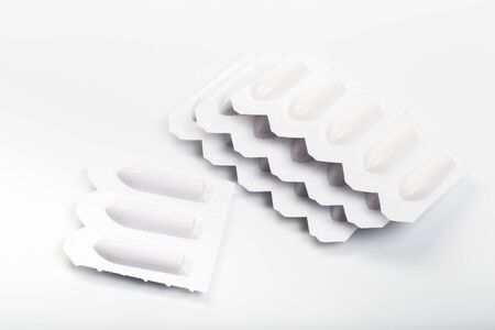 plastic packs of suppositories on white  background - Image