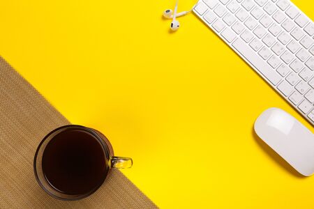 Desk with notebook, computer keyboard, mouse, coffee cup, copy space tablet - Imageの写真素材