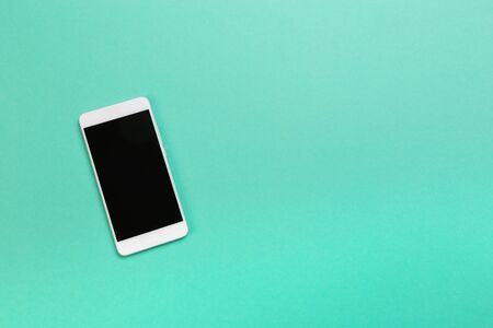 smartphone on blue background text place - Imageの写真素材