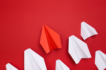 winner red  paper aircraft on red background - Imageの写真素材