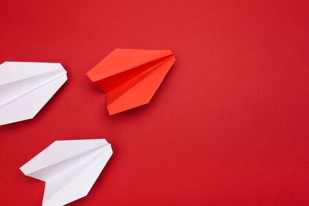 winner red  paper aircraft on red background - Image