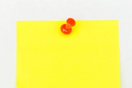 Note with a paper clip. Isolated on a white background - Image