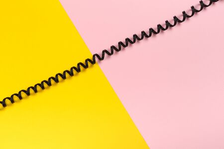 black curl cable socket on pastel colour background -  Image
