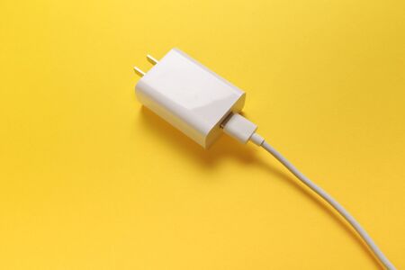 USB Micro cables ob pastel colour background. Connectors and sockets for PC and mobile devices
