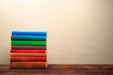 Old books on a wooden shelf. -  Image