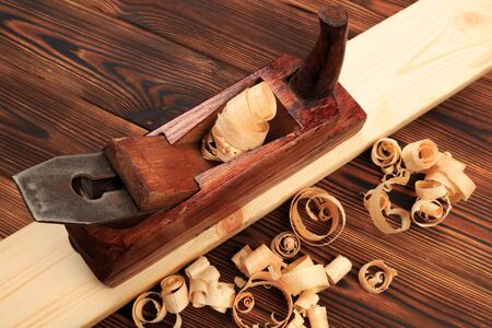 chisels plane and sawdust on a wooden table - Image