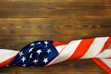 American flag on a old wooden desk top view - Image