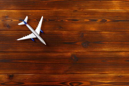 top view photo of toy airplane over wooden background - Imageの写真素材