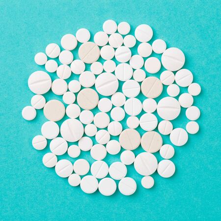 white  tablets on blue  background - Imageの写真素材