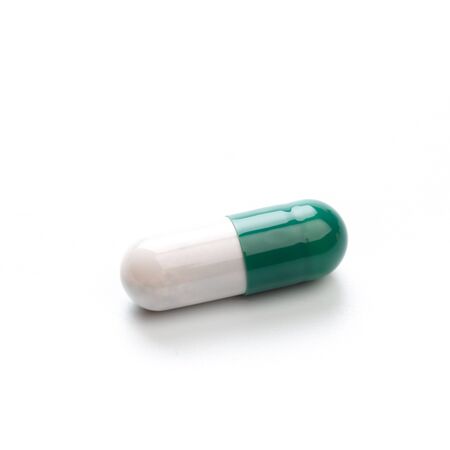 Capsule, pill on white background - isolated. Drug for health care. Biological food additives. Medical background for presentations and advertising of drugs - Imageの写真素材