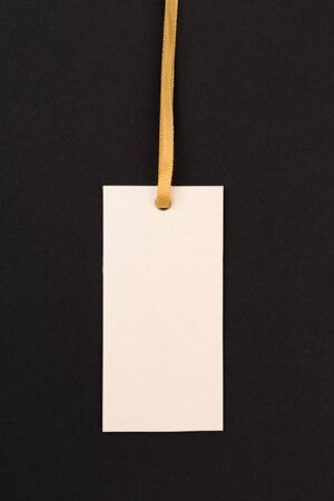 label (tag) on black background. - Image