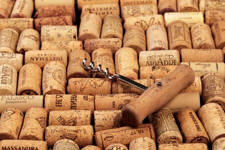 Closeup pattern background of many different wine corks with dates and drops of wineの写真素材
