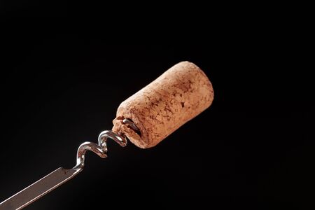 Bottle opener close-up, on dark  background.の写真素材