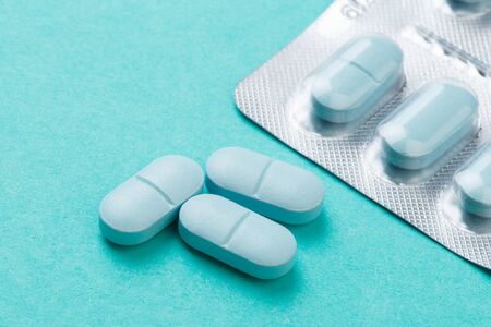 Blue tablets  on blue  background - Image
