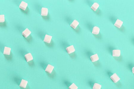 Geometry Pattern made of white sugar cubes on light blue background. Abstract, minimal style. Trendy pastel color.の写真素材