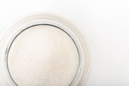 Sugar in  glass bowl on white background  top view- Imageの写真素材