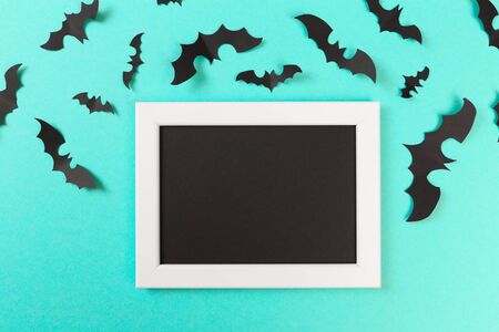Halloween paper decorations on pastel blue  background. Halloween concept. Flat lay, top view, copy...