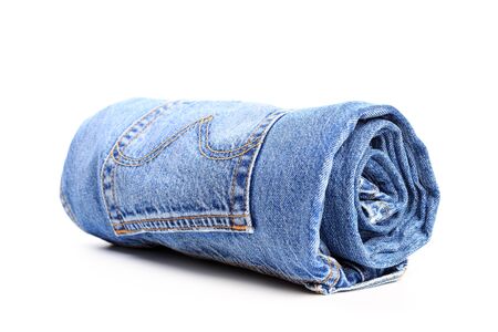 rolled jeans isolated on white backgroundの写真素材