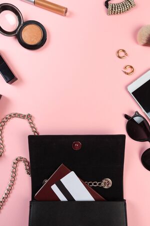 Top view of Women bag and lady stuff with copyspace on pink backgroundの写真素材