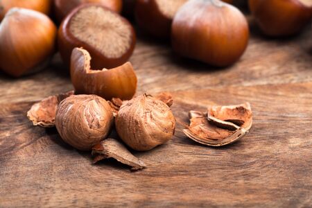 close up of hazelnuts on wooden table - Image 