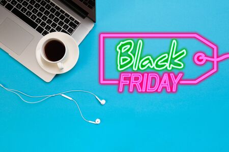 Office desk working space - Flat lay top view mockup photo of a working space with laptop, coffee cup and smartphone on blue pastel background. Pastel blue color copy space working desk concept. Black friday sale - Imageの写真素材