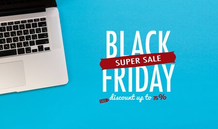 laptop on blue background flat lay place. Black friday sale - Image 