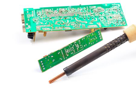 Microcircuit and soldering iron isolated on white background